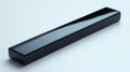 Sleek black rectangular object on white background Royalty Free Stock Photo