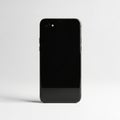Sleek Black Smartphone Back View Isolated on White Background mobile device Royalty Free Stock Photo