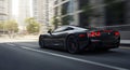 Sleek Black Sportscar: Accelerating Through a Modern Cityscape Royalty Free Stock Photo