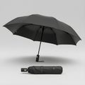 Sleek black umbrella package with case isolated against a plain white backdrop Royalty Free Stock Photo