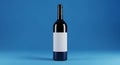A Sleek Black Wine Bottle with a Blank White Label on a Solid Blue Background glass liquid Royalty Free Stock Photo