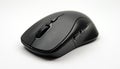 Sleek black wireless computer mouse on white background. Modern ergonomic design with scroll wheel, multiple buttons. Input