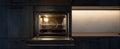 The sleek built-in oven illuminated in a modern kitchen setting..AI generated image Royalty Free Stock Photo