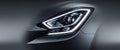 Sleek car headlight featuring modern design with bright LED lighting close up view capturing Royalty Free Stock Photo