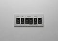 A sleek control panel with six switches labeled for different Royalty Free Stock Photo