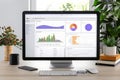 Customer relationship management dashboard showcasing analytics on a modern desk Royalty Free Stock Photo