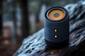 Premium Portable Bluetooth Speaker in Forest Setting Dark Grey Design with Orange Lighting