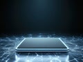 Sleek Dark Rectangular Device with Glowing Blue Border on Dark Surface Surrounded by Illuminated Network of Futuristic Royalty Free Stock Photo