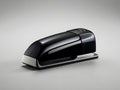 Sleek design of a single stapler against a plain backdrop with ample copy space Royalty Free Stock Photo