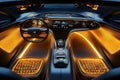 A sleek electric vehicle interior features ambient orange lighting, an advanced control Royalty Free Stock Photo