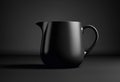 A sleek and glossy black ceramic pitcher or creamer against a dark background, showcasing its elegant curves and minimalist design