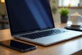 Sleek laptop, tablet phone on desk; close up view, close up, setup Royalty Free Stock Photo