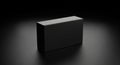 A sleek, matte black rectangular box displayed against a dark, gradient background. Royalty Free Stock Photo