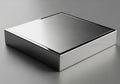 A sleek, metallic box with a brushed metal surface, featuring a rectangular, minimalist design. The Royalty Free Stock Photo
