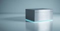 A sleek, metallic cube with a glowing blue light at the base sits on a reflective surface against a muted background Royalty Free Stock Photo