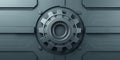 Sleek metallic gear on a dark gray panel Royalty Free Stock Photo