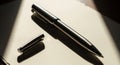 Sleek Metallic Pen with Cap, Dramatic Lighting, Shadow Play, Elegant Composition Royalty Free Stock Photo