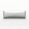 Sleek metallic rectangular object with reflective surface against plain background Royalty Free Stock Photo