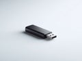 Sleek, minimalist image of a dark USB drive. Represents data storage, memory, and technology. Clean background for easy Royalty Free Stock Photo