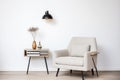 sleek minimalist reading corner with a comfy chair and a small table Royalty Free Stock Photo