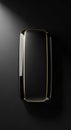 Sleek, minimalist rectangular object with rounded edges, set against a dark Royalty Free Stock Photo