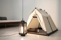 sleek and minimalist tent in neutral colors with solar-powered lantern and portable bluetooth speaker