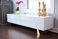 a sleek, minimalist tv stand in high gloss white