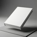 A sleek modern book or tablet resting at an angled position on a reflective surface Royalty Free Stock Photo