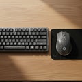 Compact black mechanical keyboard is positioned to the left, featuri Royalty Free Stock Photo