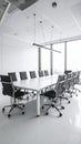 Sleek modern conference room interior with a large white table and black leather chairs Royalty Free Stock Photo