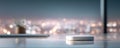 Sleek, modern device on a marble desk, showcasing connectivity and advanced technology. Blurred city lights create a sophisticated Royalty Free Stock Photo