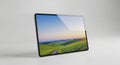 Sleek Modern Digital Tablet with Blank Screen Displaying Rolling Green Hills and Tranquil Sky Royalty Free Stock Photo
