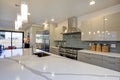 Sleek modern kitchen design with a long center island.