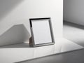 Sleek modern poster frame rectanguler in shape standing on the white wall Royalty Free Stock Photo