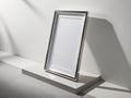 Sleek modern poster frame rectanguler in shape standing on the white wall Royalty Free Stock Photo
