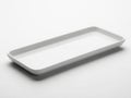 A sleek and modern rectangular serving tray with a smooth metallic finish. isolated on white background Royalty Free Stock Photo