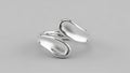 Modern silver ring with overlapping, curved elements creating Royalty Free Stock Photo