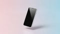 Sleek modern smartphone with a black screen tilted and floating against a soft pink and blue gradient background Royalty Free Stock Photo