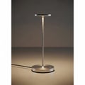 Sleek modern table lamp featuring a minimalist design with a thin, metallic stand. The base is Royalty Free Stock Photo