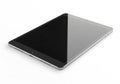 A sleek modern tablet device with a dark screen rests on a clean bright surface Royalty Free Stock Photo