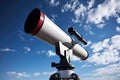 sleek, modern telescope pointed toward a daytime sky