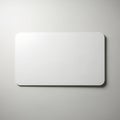 A sleek, modern white rectangular object mounted on a plain grey wall Royalty Free Stock Photo
