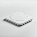 A sleek, modern wireless charging pad with a square shape and rounded corners, Royalty Free Stock Photo
