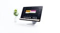 Modern Workspace with Audio Editing Software on Computer Screen and Plant