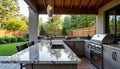 Sleek outdoor kitchen features granite countertops, stainless steel appliances. Modern design perfect for summer meals al fresco.