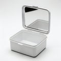 A sleek, polished silver rectangular box with a hinged lid, reflecting light Royalty Free Stock Photo