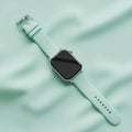 A sleek rectangular black screen and a mint green silicone strap Royalty Free Stock Photo