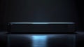 Sleek Rectangular Object Illuminated on Dark Surface Royalty Free Stock Photo