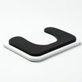 A sleek, rectangular object with a white base and a black, textured, U-shaped cushion on Royalty Free Stock Photo