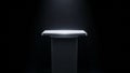 Sleek Rectangular Pedestal with Glowing Top Surface in Dark Environment display stand podium Royalty Free Stock Photo